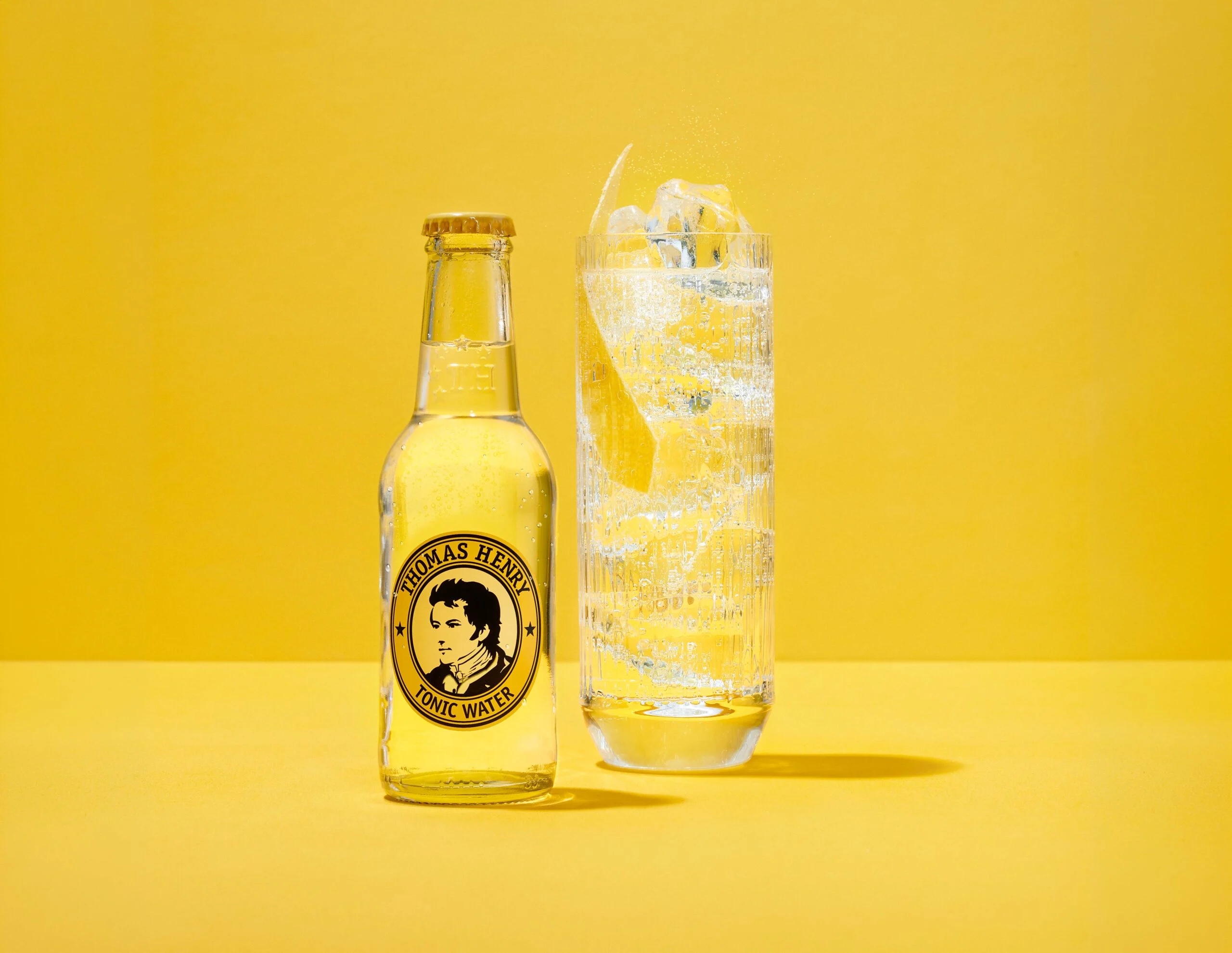 Thomas Henry tonic water and drink on yellow